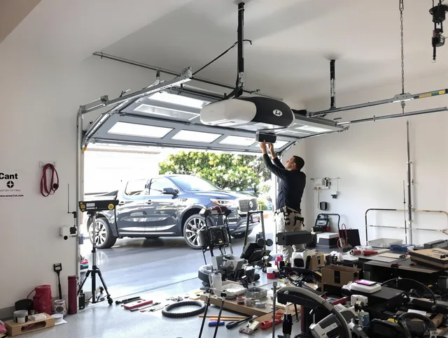 Maynard Garage Door Repair specialist installing smart garage door opener system in Maynard home