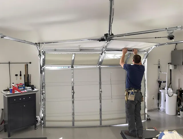 Maynard Garage Door Repair specialist performing precise section replacement on Maynard garage door