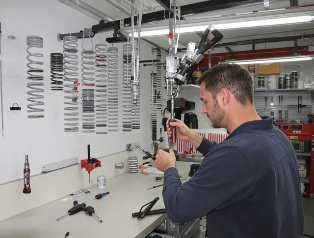 Maynard Garage Door Repair safety certified technician performing precision spring replacement in Maynard