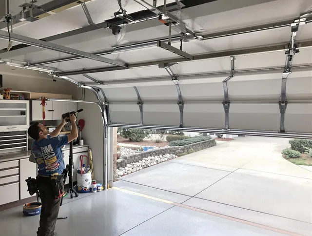 Garage door track repair service by Maynard Garage Door Repair in Maynard